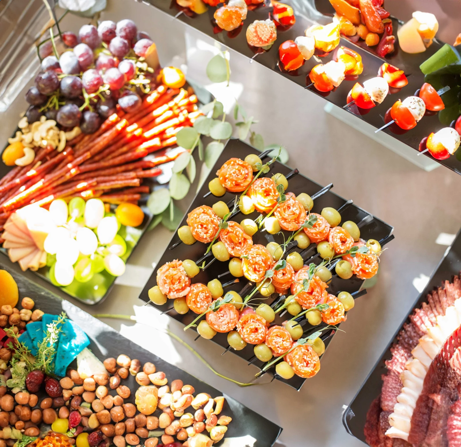 Wedding canapes set of appetizers with red fish olives and sesame